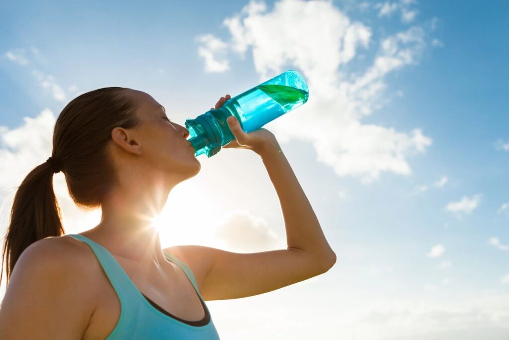 Young Woman Drinking Water from a Water Bottle